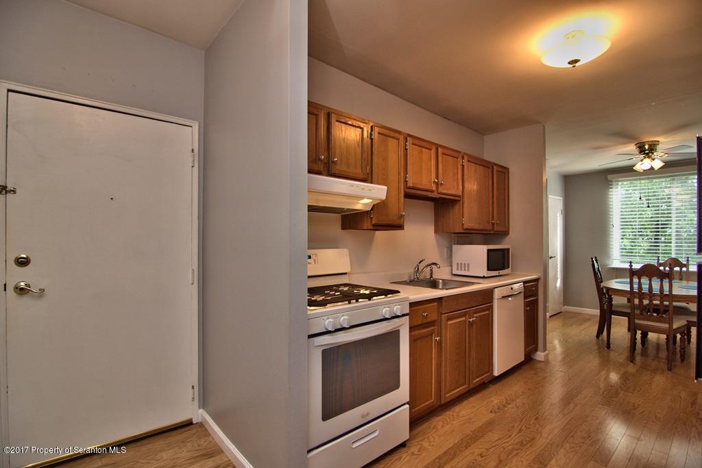1211 Summit Pointe Scranton, PA 18508 - Photo 3 of 33 a kitchen with stainless steel appliances granite countertop a stove and a refrigerator