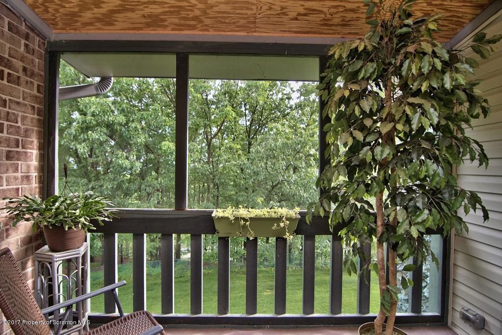 1211 Summit Pointe Scranton, PA 18508 - Photo 33 of 33 a view of a porch with a table and chairs