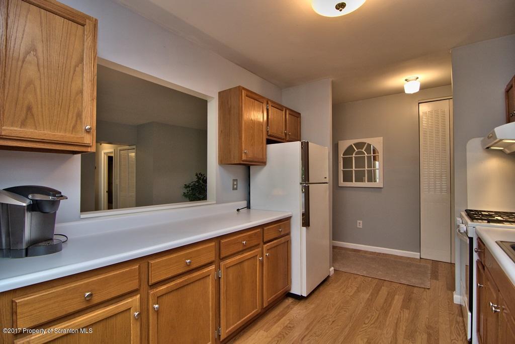 1211 Summit Pointe Scranton, PA 18508 - Photo 9 of 33 a spacious bathroom with a granite countertop sink and a mirror