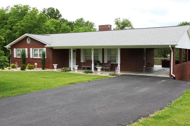a view of house with outdoor space and porch