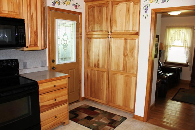 65 Iron Ridge Road Rocky Mount, VA 24151 - Photo 12 of 33 a view of a kitchen with wooden floor cabinets and front door