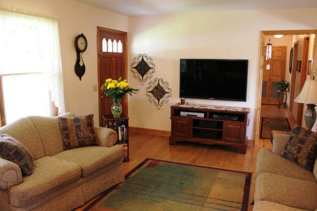 65 Iron Ridge Road Rocky Mount, VA 24151 - Photo 18 of 33 a living room with furniture and a flat screen tv