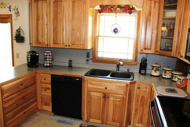 65 Iron Ridge Road Rocky Mount, VA 24151 - Photo 22 of 33 a kitchen with stainless steel appliances a stove a sink and a microwave