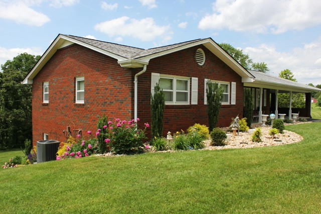 65 Iron Ridge Road Rocky Mount, VA 24151 - Photo 32 of 33 a front view of a house with a yard