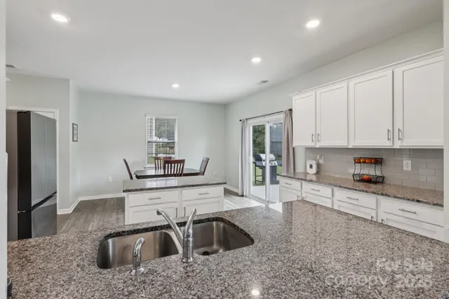 a kitchen with a refrigerator a sink and dishwasher