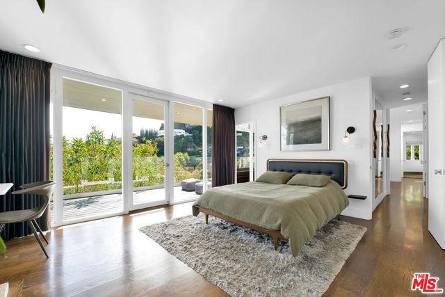 a bathroom with a bathtub a sink a toilet and shower