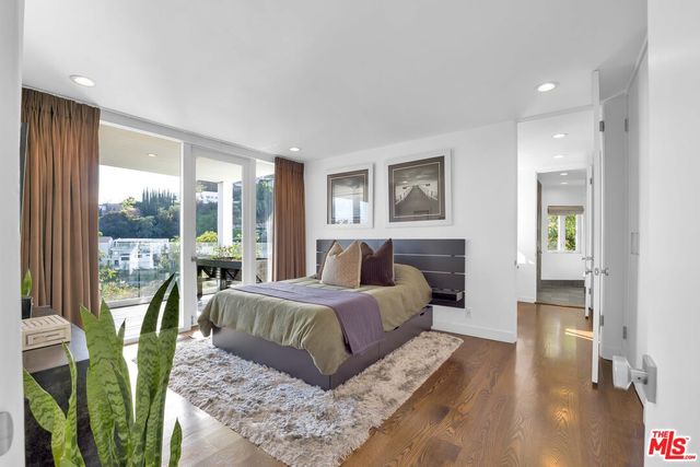 a kitchen with stainless steel appliances a stove a sink and a refrigerator