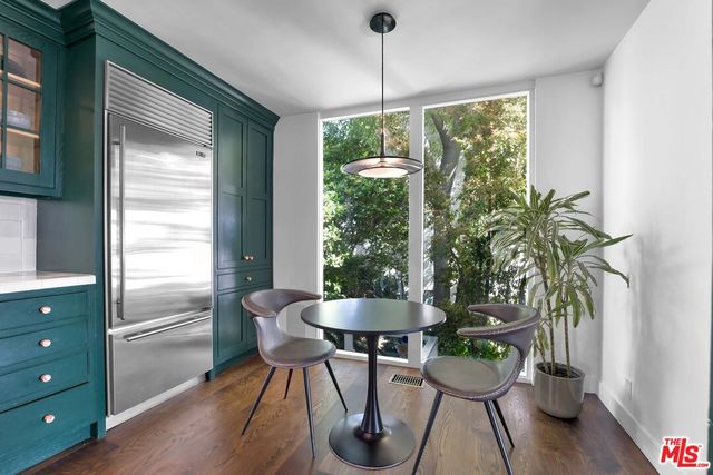 a bathroom with a sink a mirror and a lamp