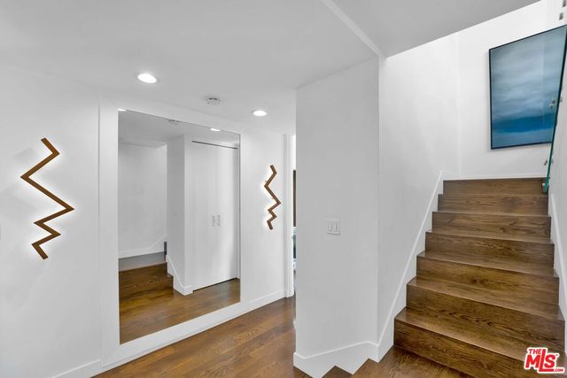 a bedroom with a bed and a fireplace