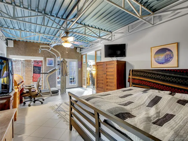 a bedroom with a bed and a walk in closet