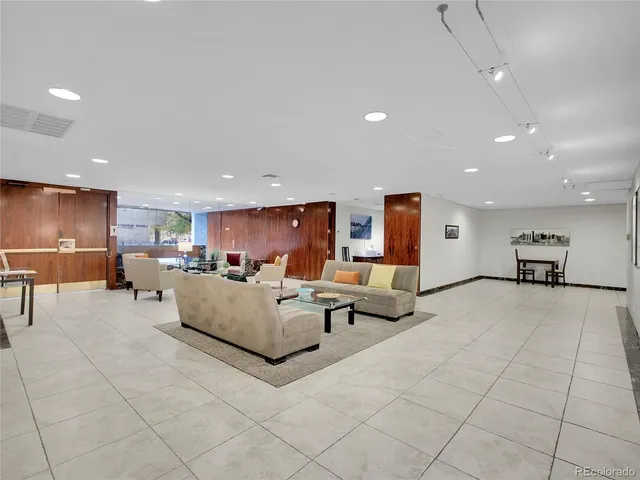 a living room with furniture and a table