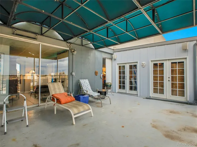 a view of a lounge chairs in the patio
