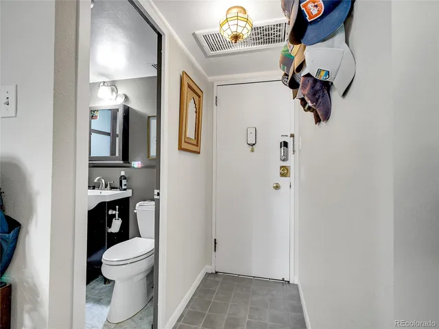 a bathroom with a toilet and a sink