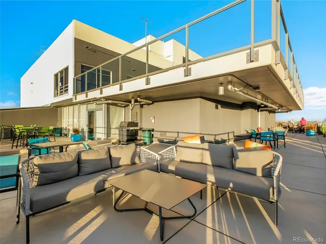 a patio with a table and chairs