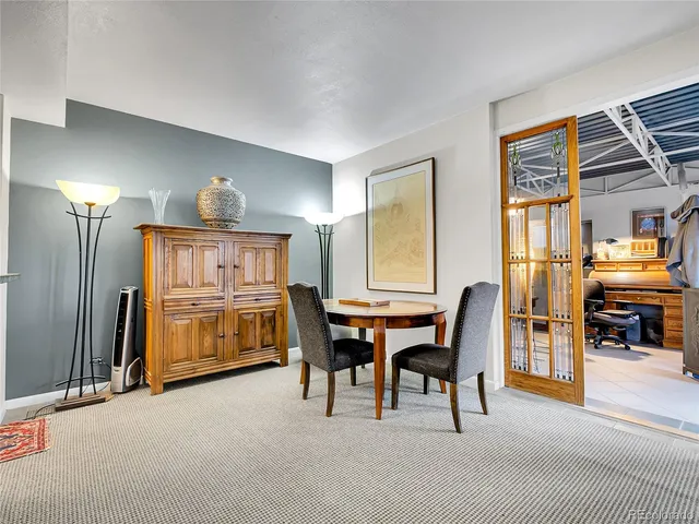a view of a livingroom with furniture and chandelier