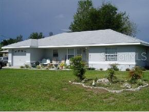 2 Pecan Course Terrace Ocala, FL 34472 - Photo 1 of 1 a front view of a house with garden