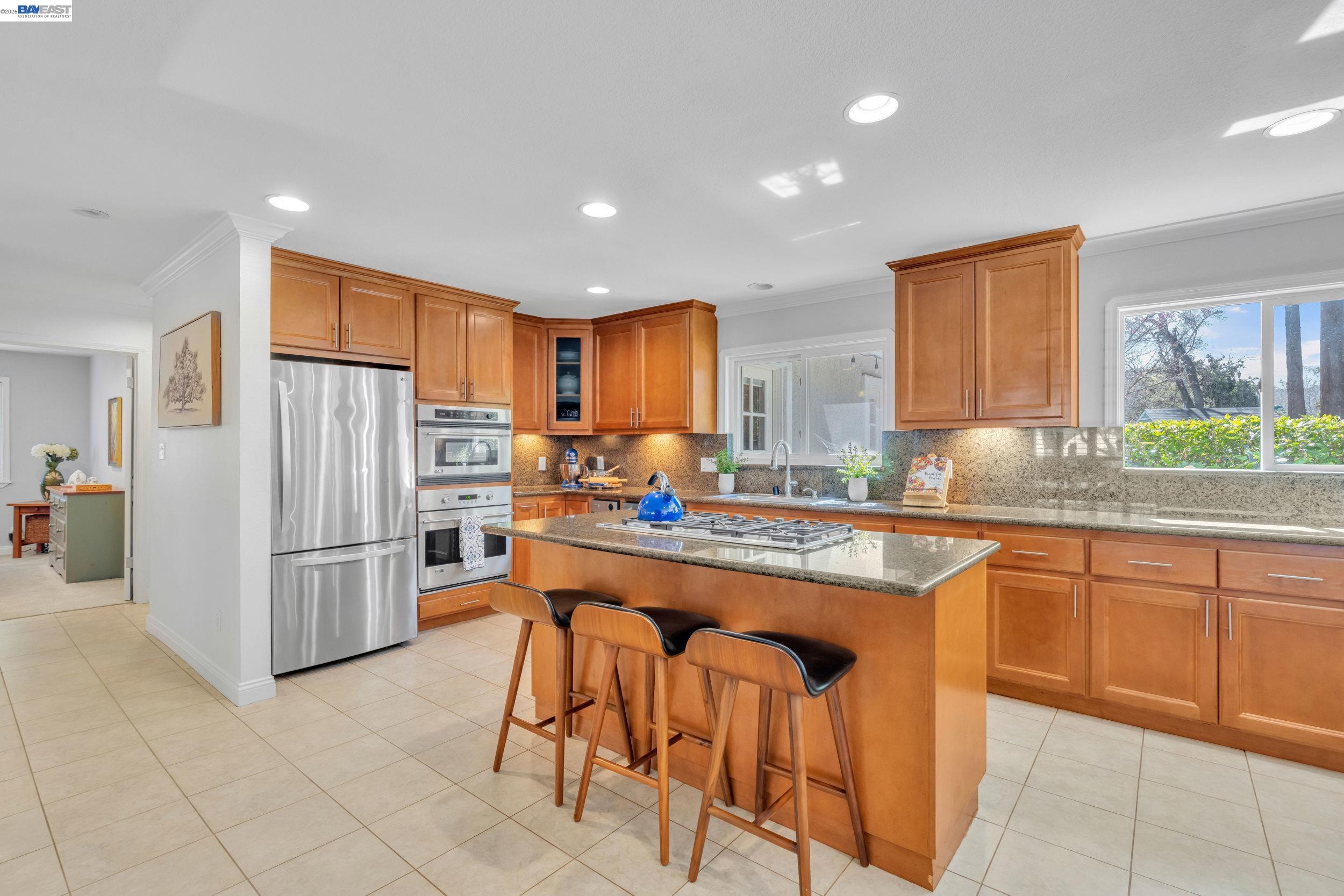 2070 Raven Road Pleasanton, CA 94566 - Photo 11 of 34 a kitchen with stainless steel appliances granite countertop a stove a sink a refrigerator and a refrigerator