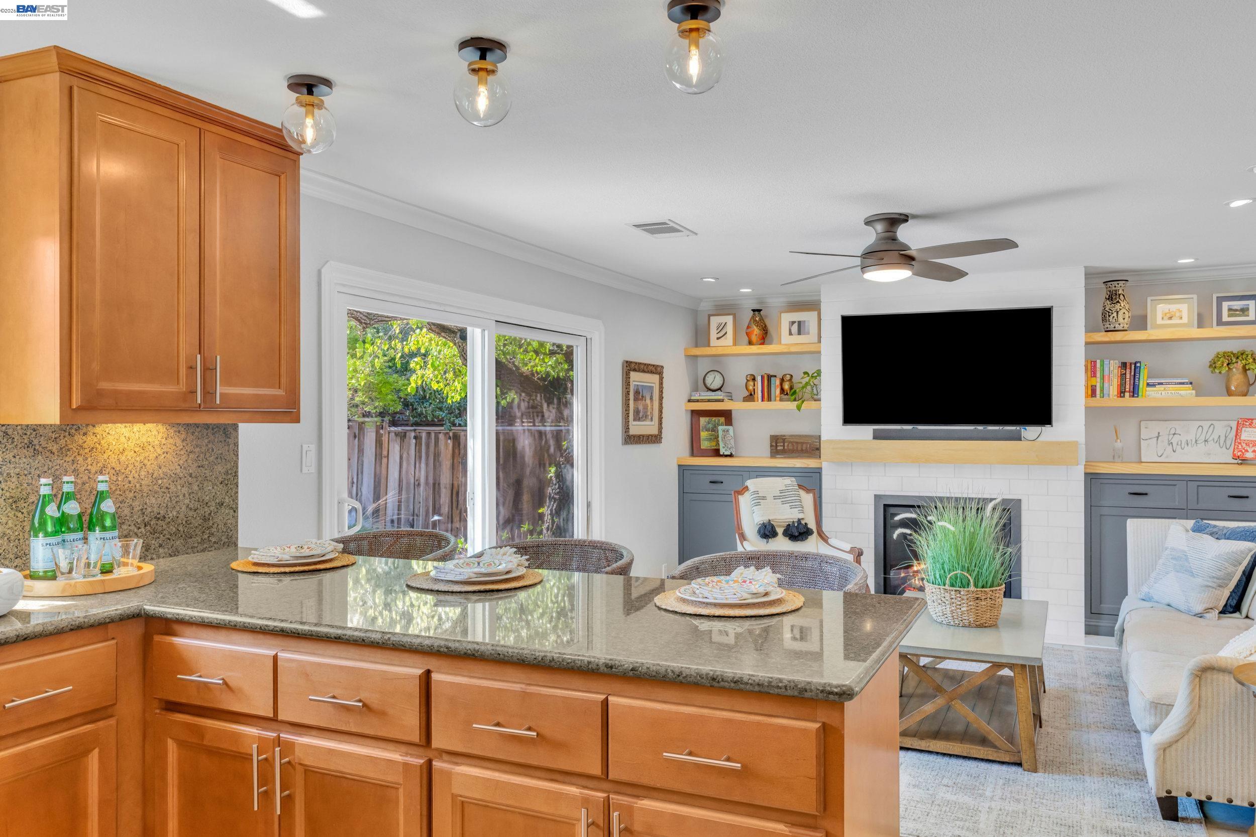 2070 Raven Road Pleasanton, CA 94566 - Photo 12 of 34 a kitchen with stainless steel appliances granite countertop a sink and a microwave