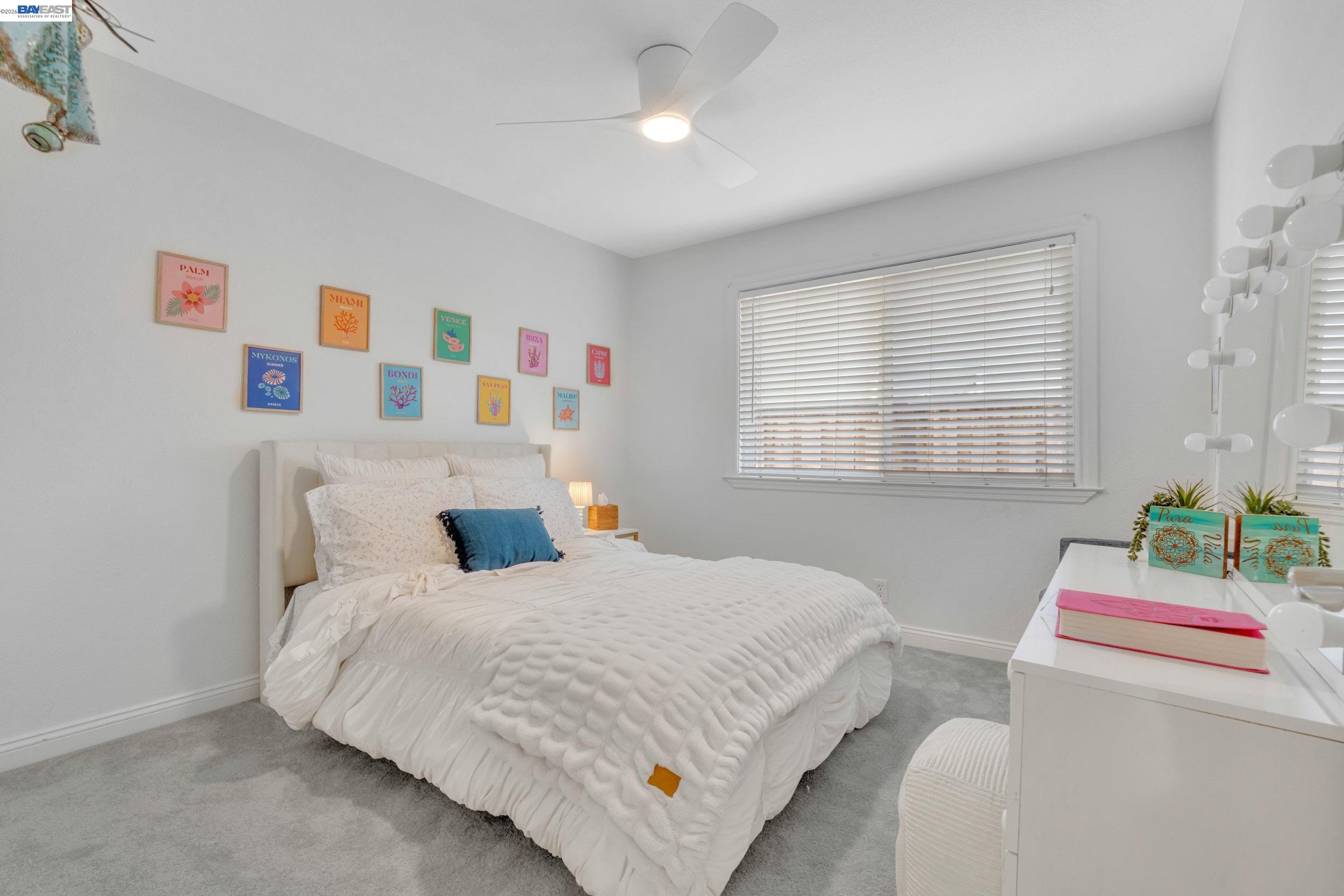 2070 Raven Road Pleasanton, CA 94566 - Photo 15 of 34 a bedroom with a bed a dresser and a window