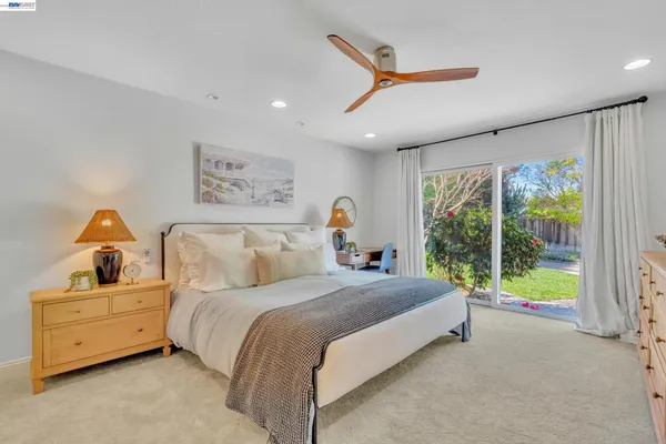 a bed room with a bed and a window