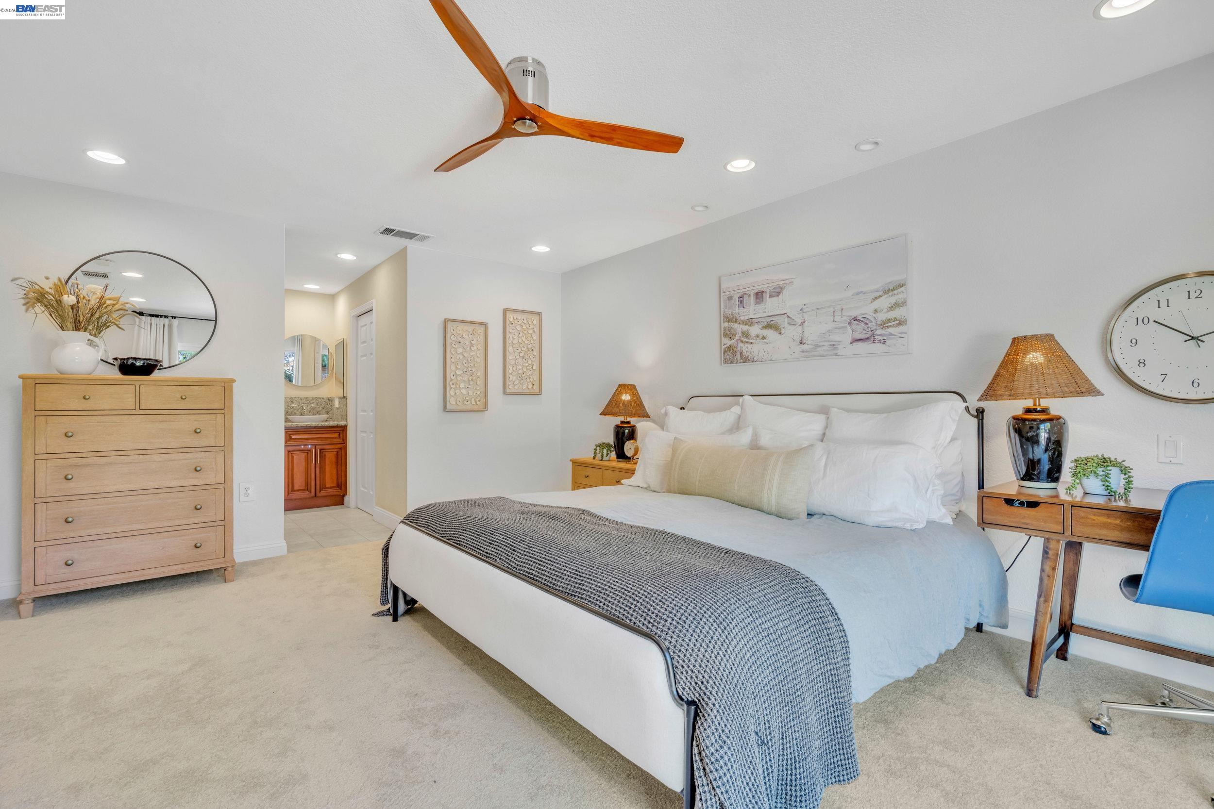 2070 Raven Road Pleasanton, CA 94566 - Photo 19 of 34 a bedroom with a bed a dresser and chair