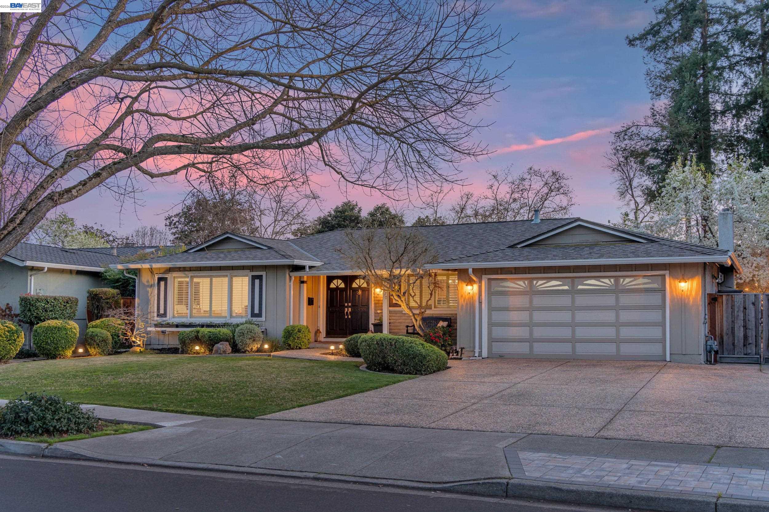 2070 Raven Road Pleasanton, CA 94566 - Photo 2 of 34 a front view of a house with a yard and garage