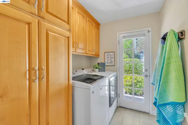 a view of a kitchen with washer and dryer