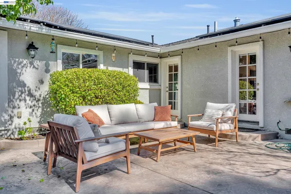 a outdoor living space with furniture and a potted plant