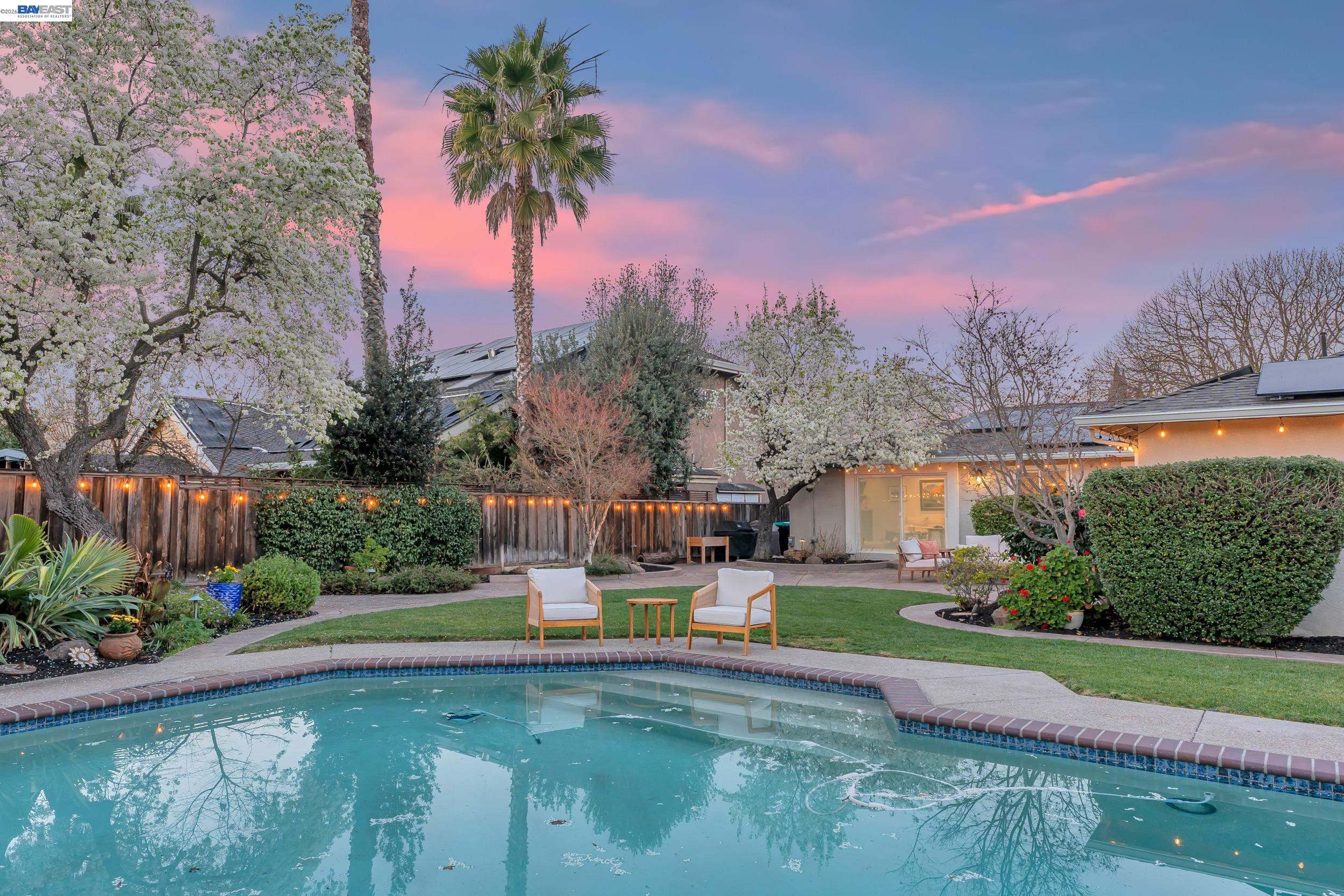 2070 Raven Road Pleasanton, CA 94566 - Photo 30 of 34 a swimming pool with outdoor seating and yard