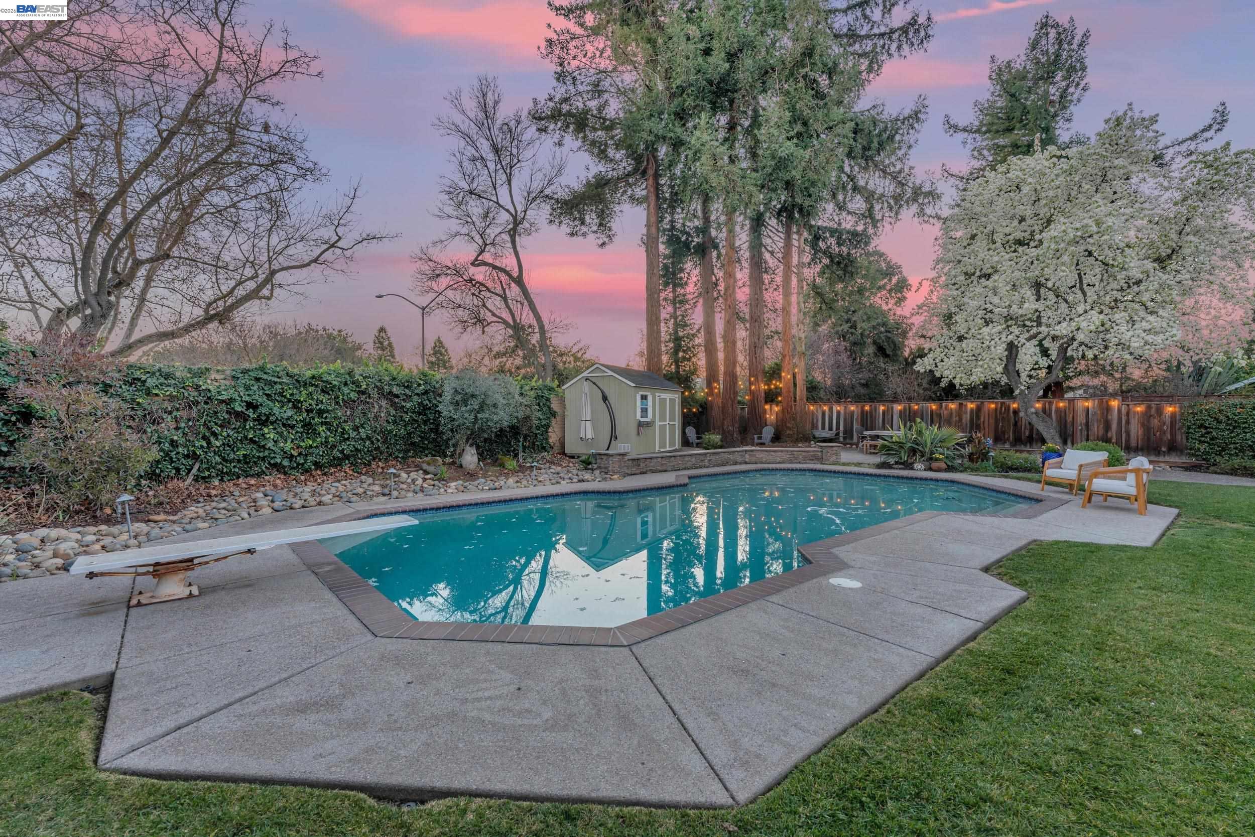 2070 Raven Road Pleasanton, CA 94566 - Photo 33 of 34 a view of a swimming pool with a yard
