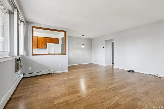 a view of a livingroom with wooden floor