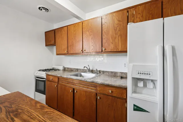 a view of an empty room and wooden floor
