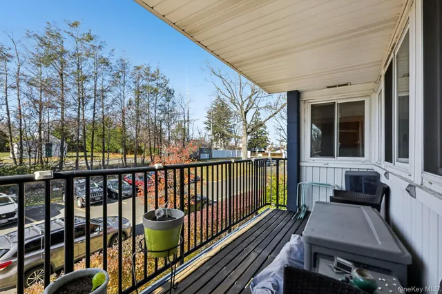 a view of balcony with furniture