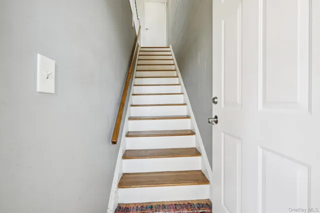 a view of an entryway with wooden floor