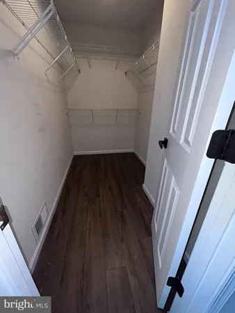 a bathroom with a double vanity sink and mirror