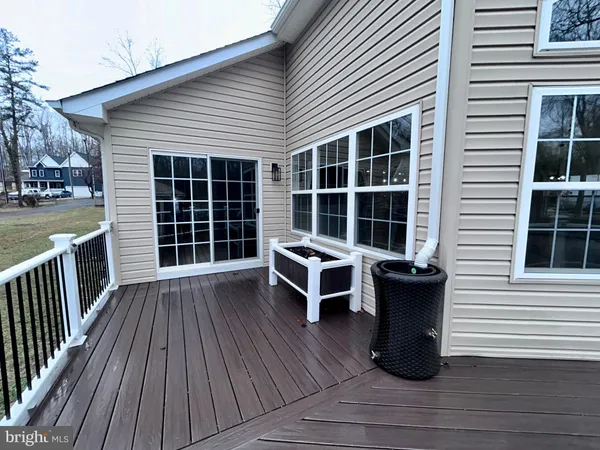 a view of a backyard with sitting area