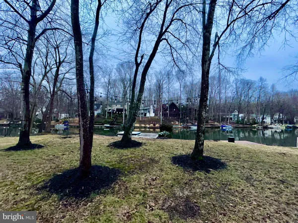 a view of a wooden deck with lake view