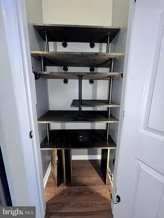 a view of gallery with wooden floor