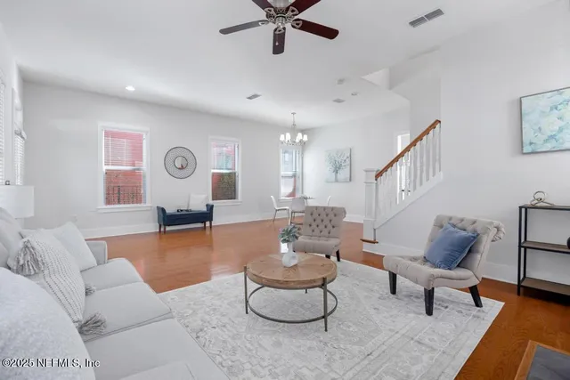 a living room with furniture and a table
