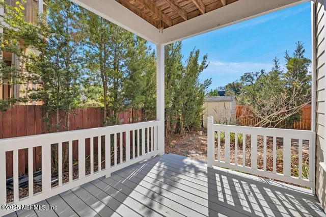 a view of a wooden fence and floor