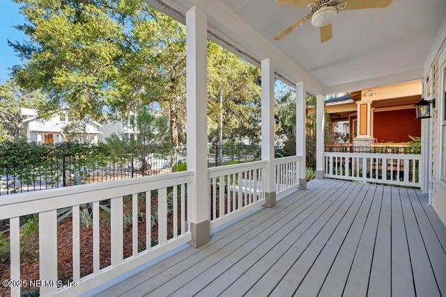 a view of a house with wooden deck