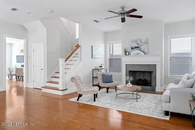 a living room with furniture and a fireplace