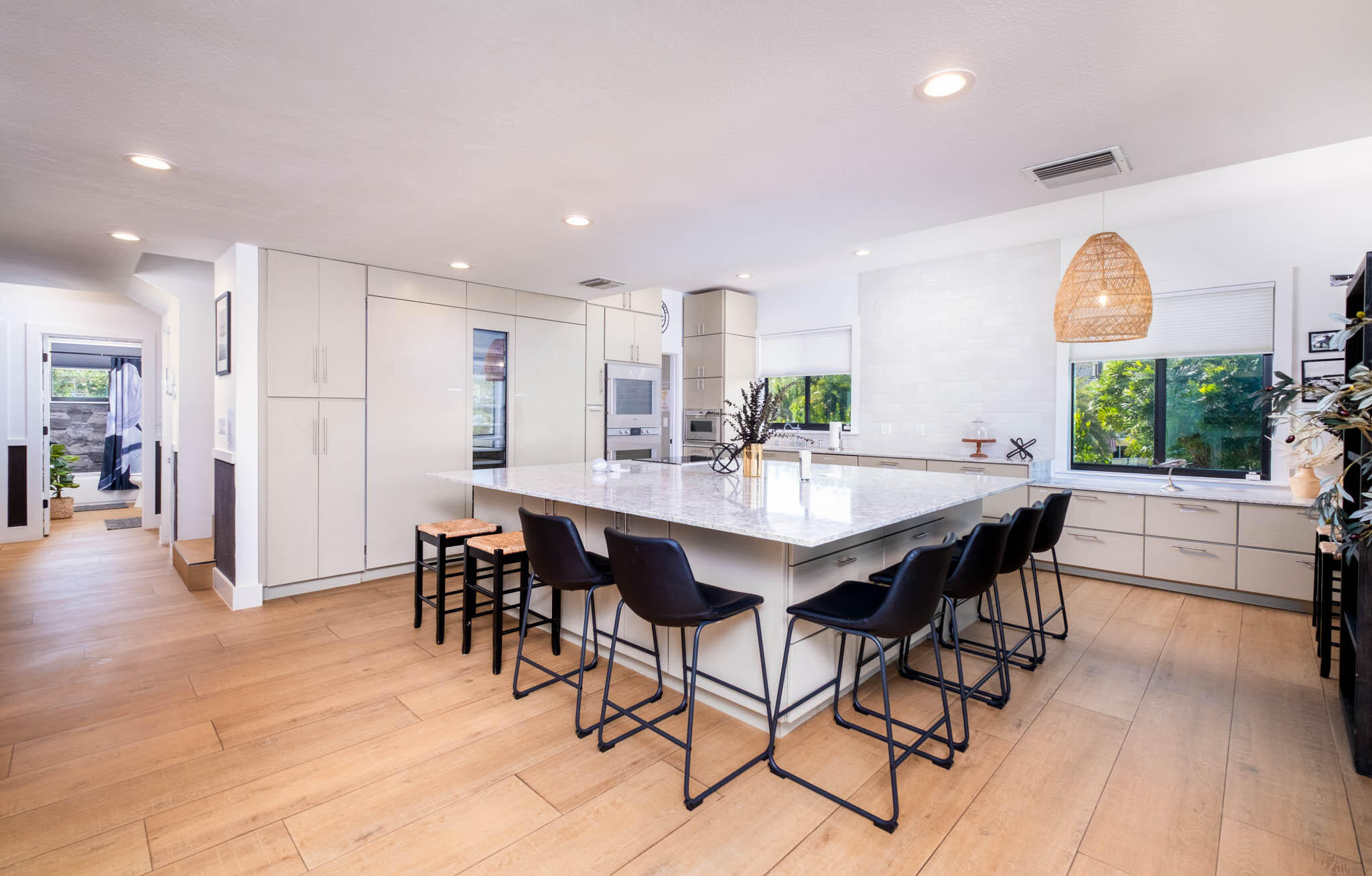 55 Ocean Front Drive Key Largo, FL 33037 - Photo 20 of 59 a view of a dining room with furniture and wooden floor