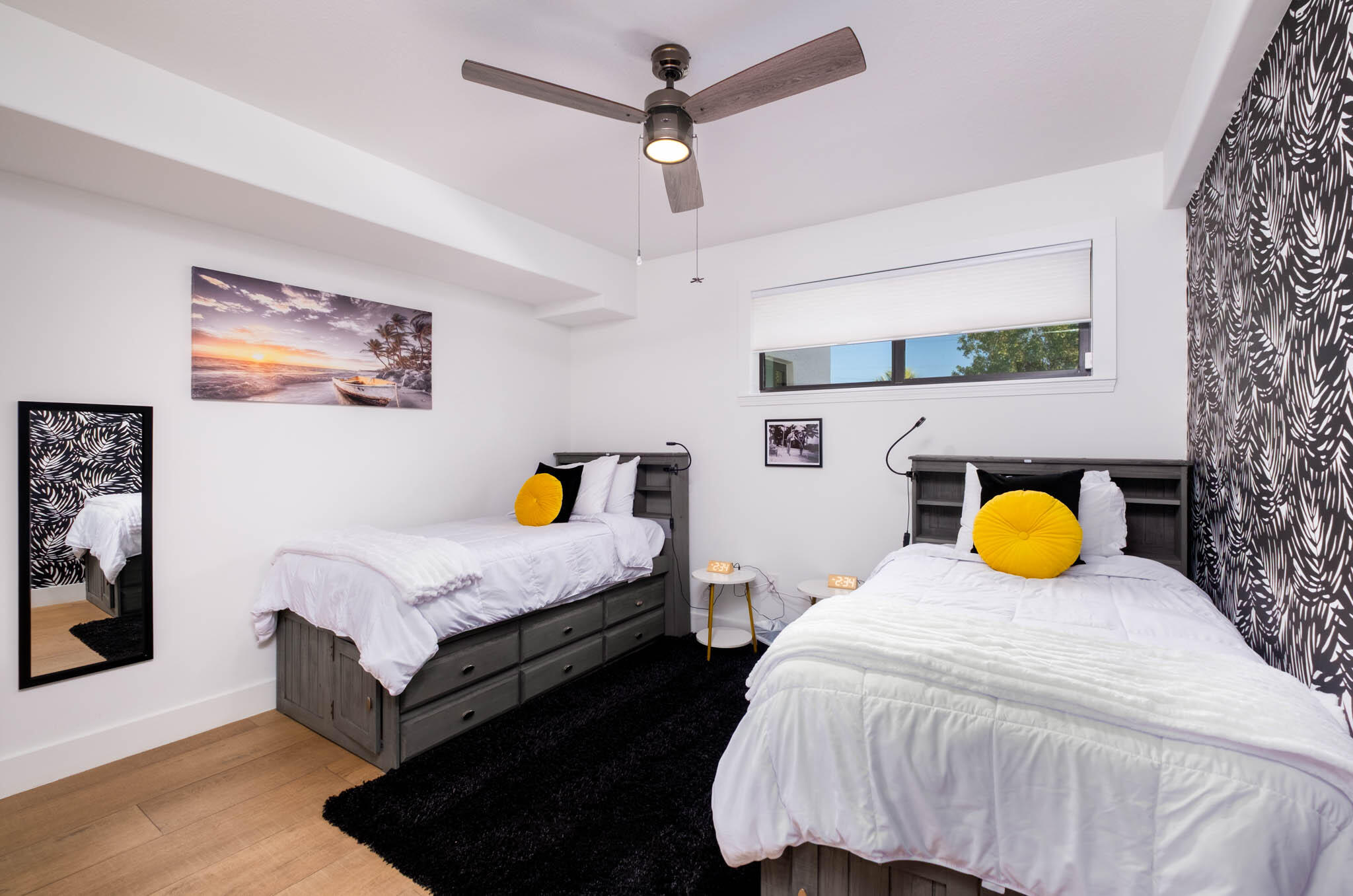 55 Ocean Front Drive Key Largo, FL 33037 - Photo 25 of 59 a bedroom with a bed dresser and a lamp