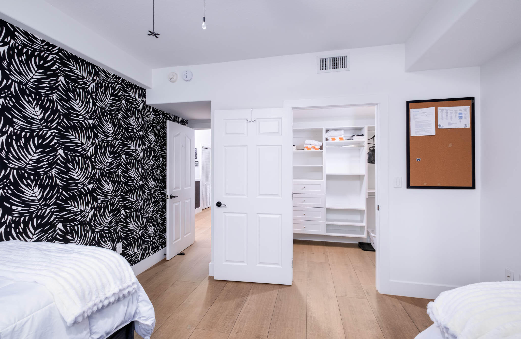 55 Ocean Front Drive Key Largo, FL 33037 - Photo 26 of 59 a bedroom with a bed and a walk in closet