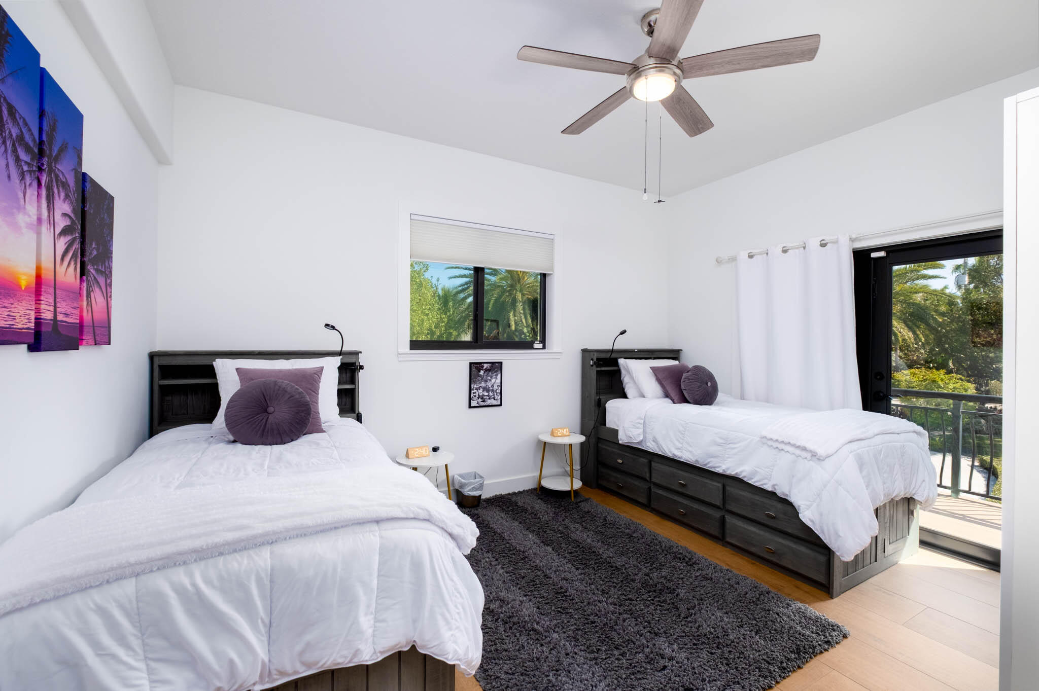 55 Ocean Front Drive Key Largo, FL 33037 - Photo 27 of 59 a bedroom with a large bed and a chandelier fan