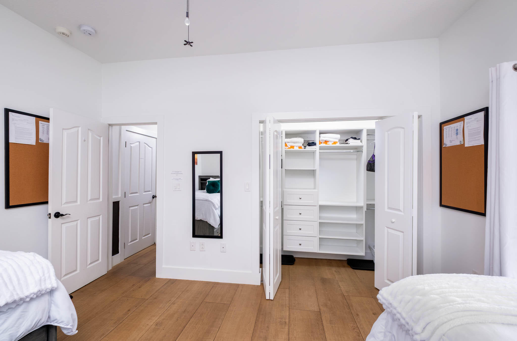 55 Ocean Front Drive Key Largo, FL 33037 - Photo 30 of 59 a view of a bedroom with closet wooden floor and window