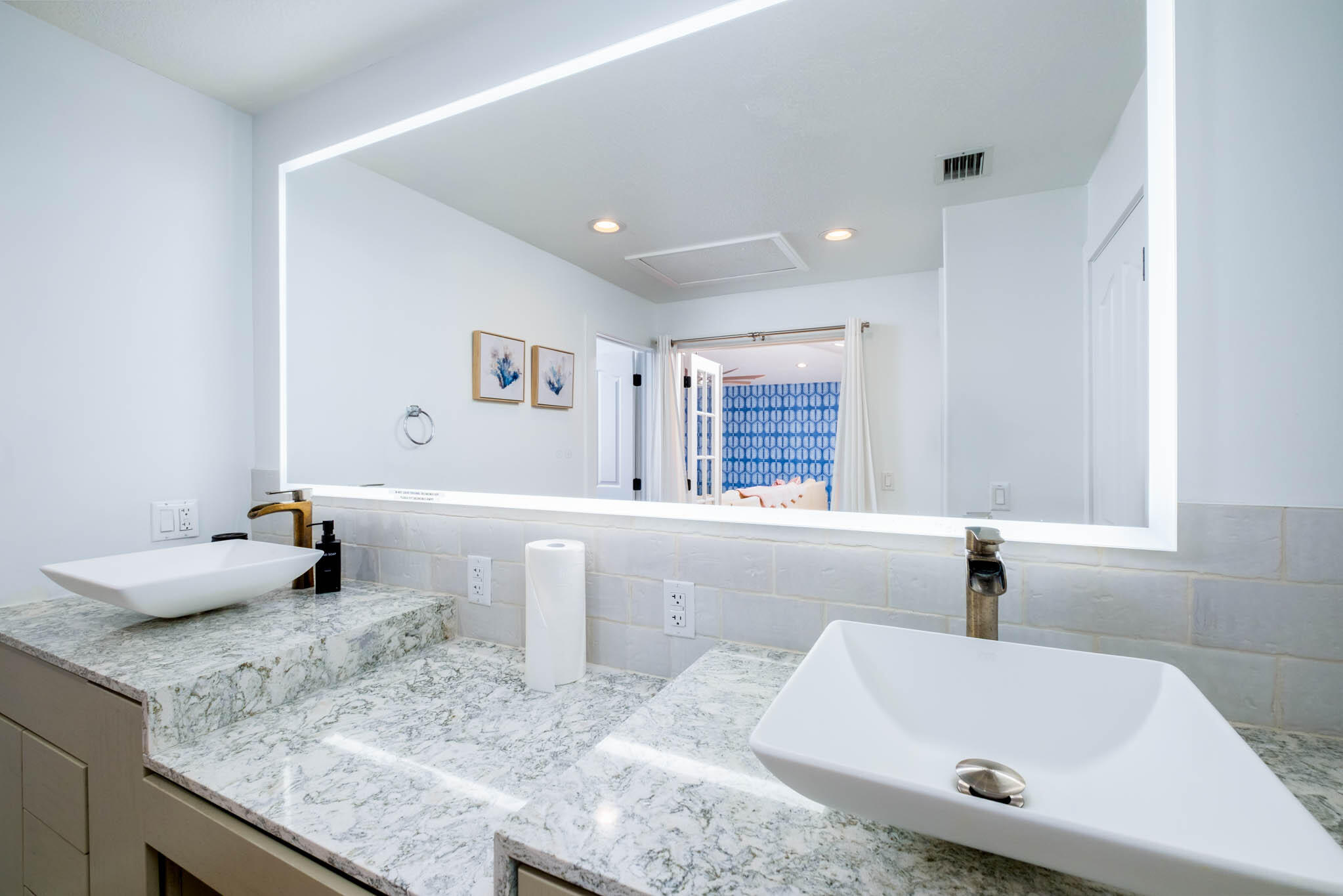 55 Ocean Front Drive Key Largo, FL 33037 - Photo 35 of 59 a bathroom with a granite countertop sink and a bathtub