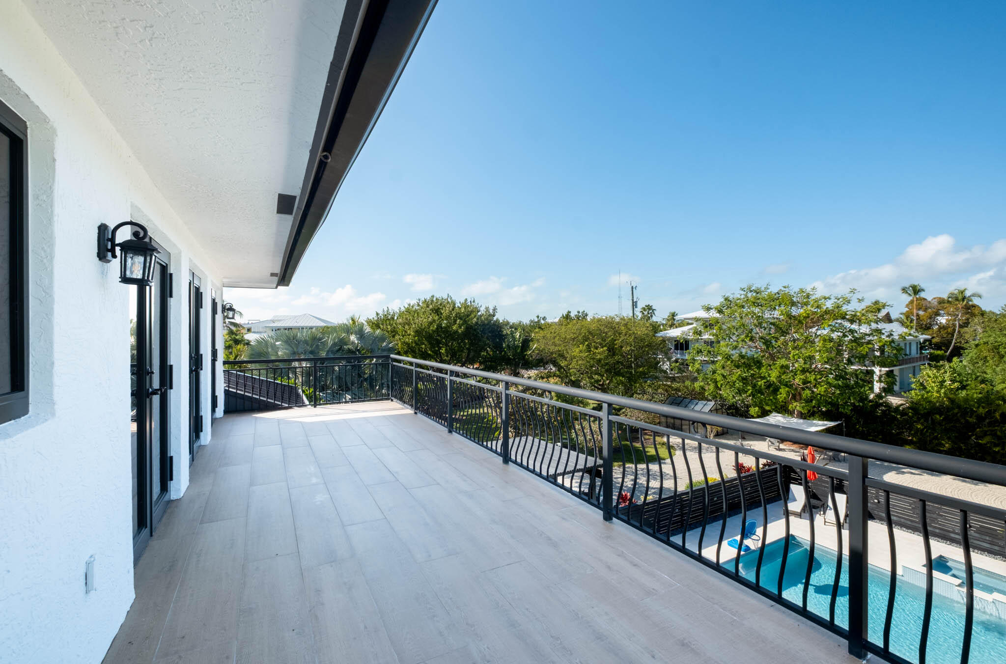 55 Ocean Front Drive Key Largo, FL 33037 - Photo 41 of 59 a view of a balcony with wooden floor