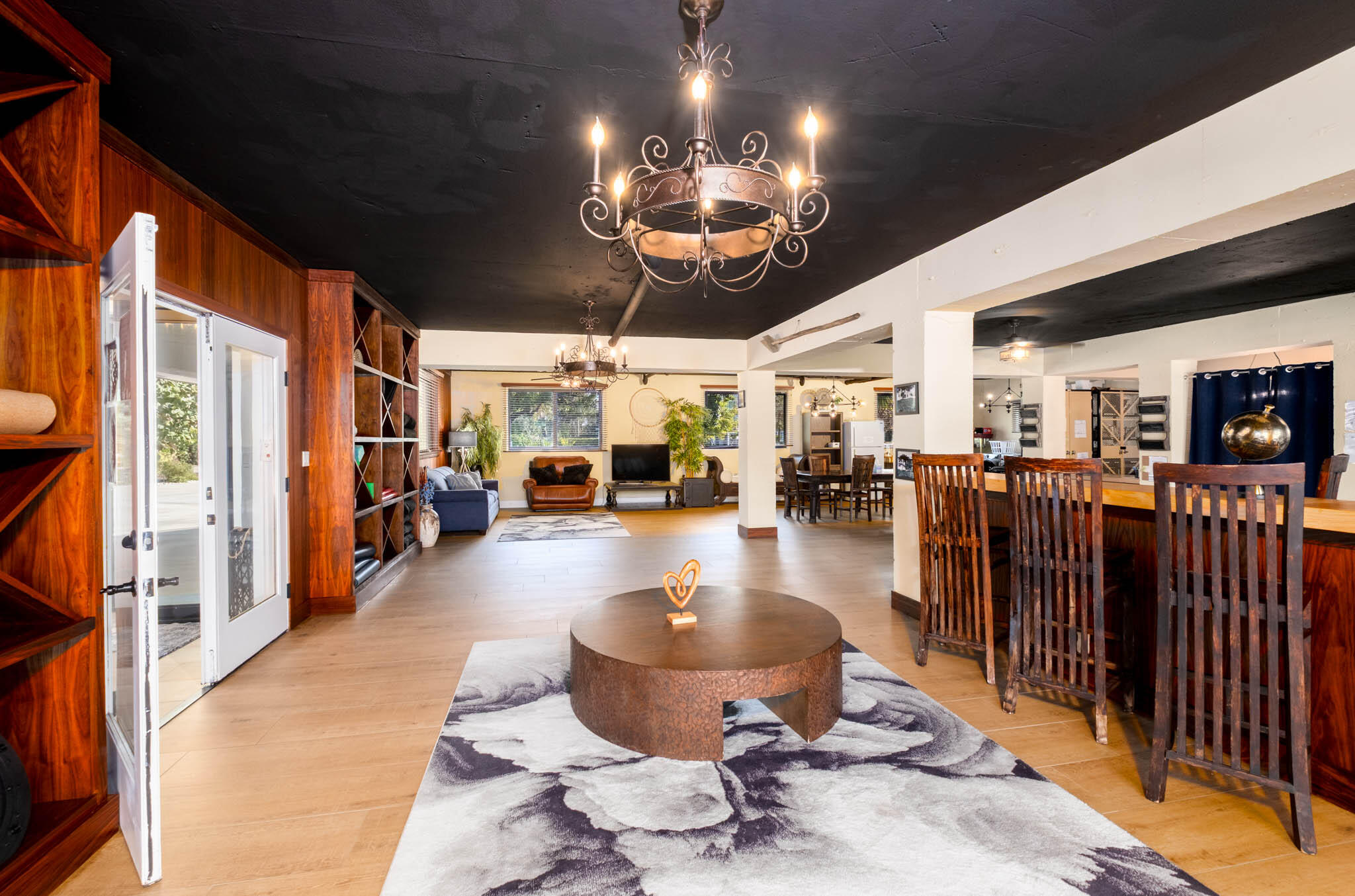 55 Ocean Front Drive Key Largo, FL 33037 - Photo 43 of 59 a living room with lots of furniture and a chandelier